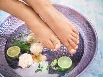 Woman showing feet after pedicure